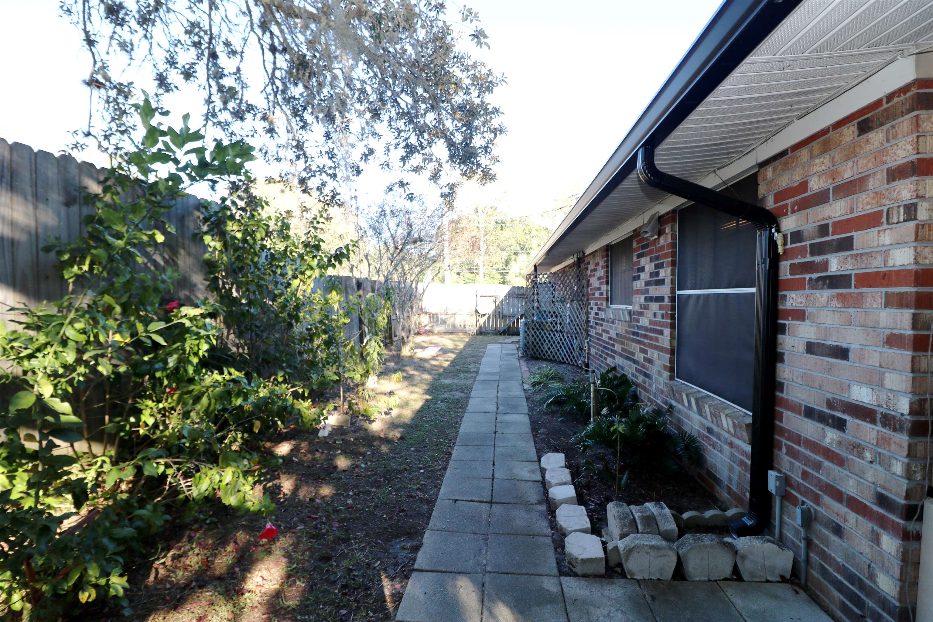 222 Jasmine Road St. Augustine, FL 32086 - Photo 25 of 30 a backyard of a house with lots of green space