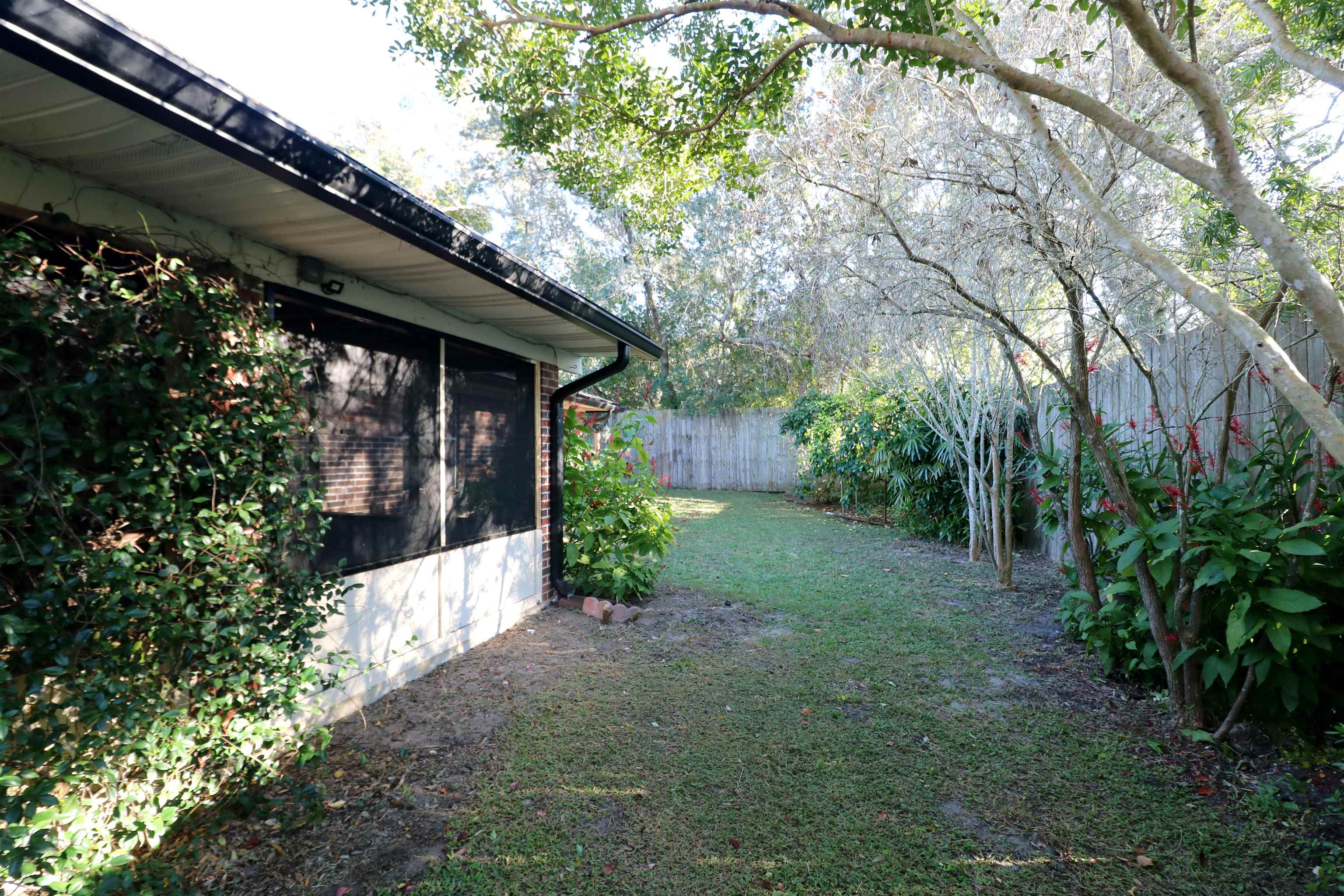 222 Jasmine Road St. Augustine, FL 32086 - Photo 26 of 30 a view of a house with a yard