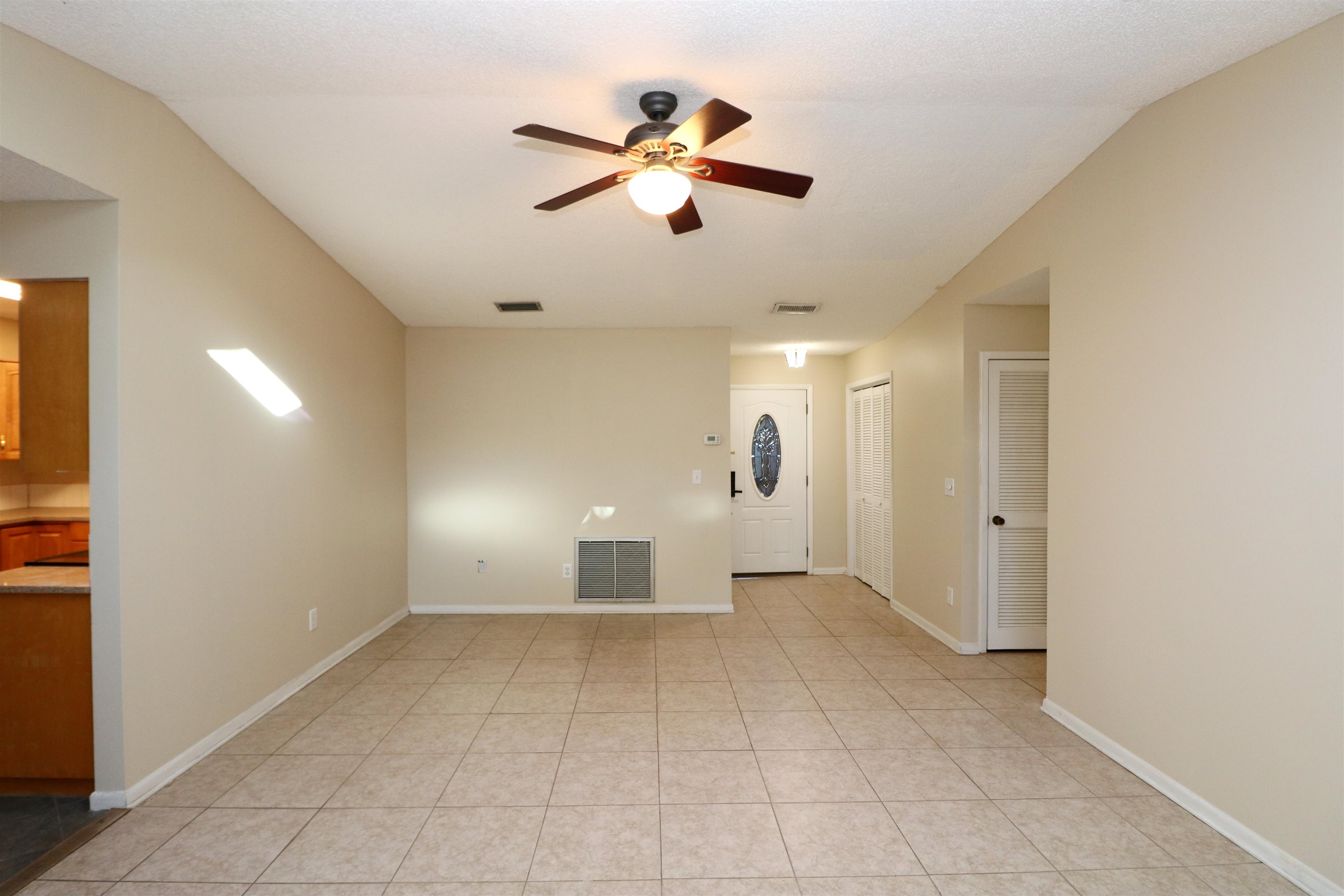222 Jasmine Road St. Augustine, FL 32086 - Photo 5 of 30 a view of an empty room with a ceiling fan