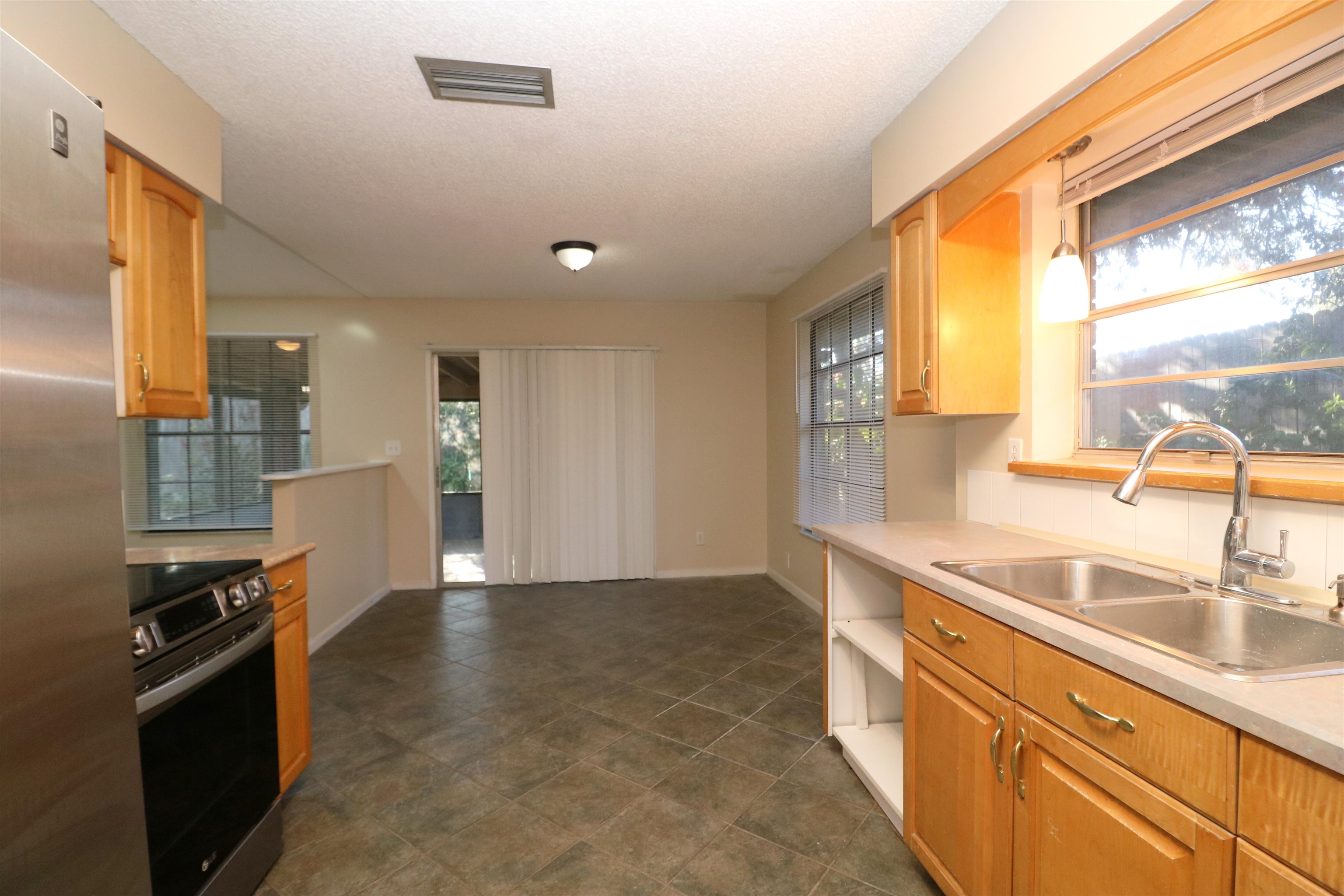 222 Jasmine Road St. Augustine, FL 32086 - Photo 10 of 30 a view of a kitchen with a sink and large window