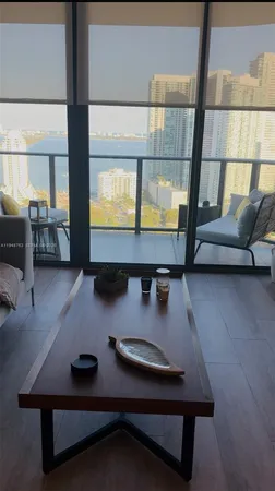 a room with furniture pool table and projector