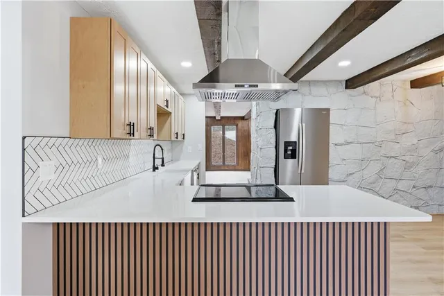 a view of an empty room with windows