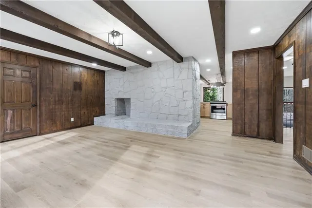 a view of balcony with wooden floor and fence