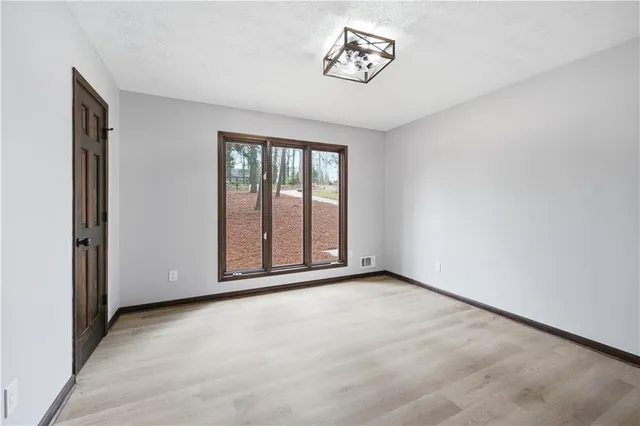 a bathroom with a toilet a sink and a mirror