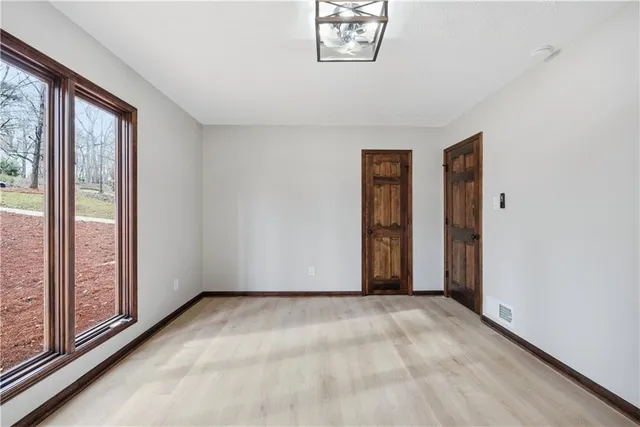 a view of a kitchen with a sink and a stove top oven