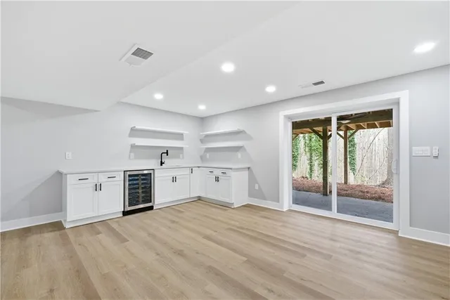 a view of balcony with wooden floor and fence