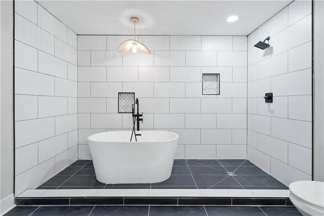 an aerial view of residential house and green space