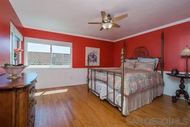 a bedroom with furniture and window