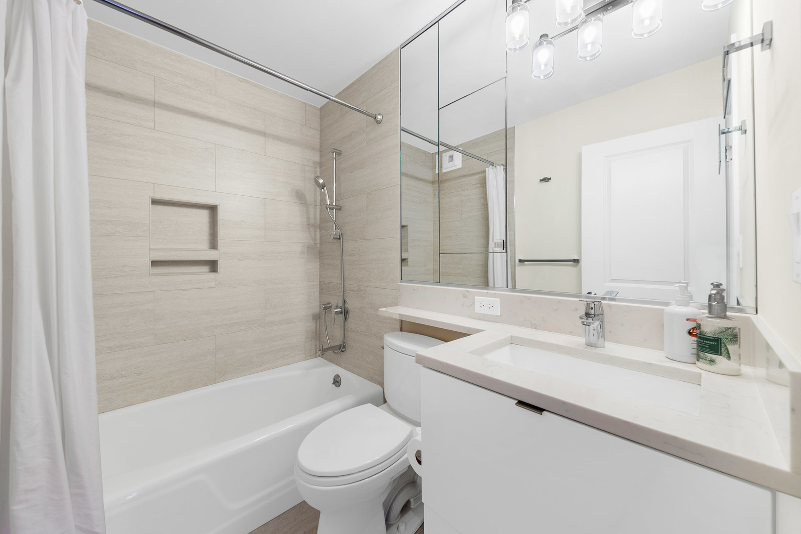 1310 North Ritchie Court, Unit 11C Chicago, IL 60610 - Photo 11 of 21 a bathroom with a sink toilet vanity and shower