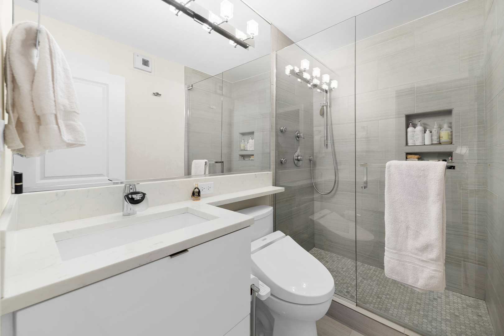 1310 North Ritchie Court, Unit 11C Chicago, IL 60610 - Photo 13 of 21 a bathroom with a sink a toilet and shower