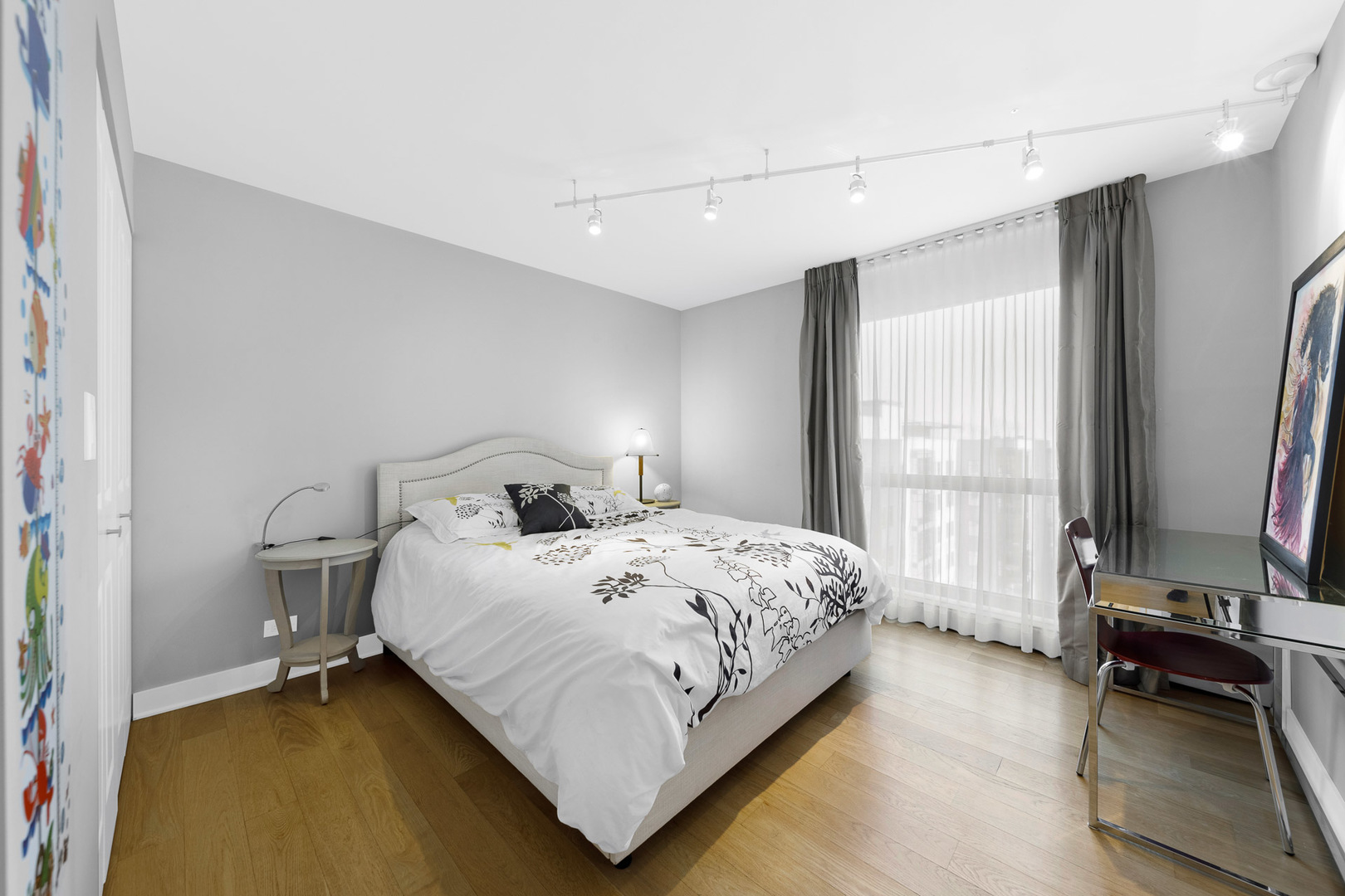 1310 North Ritchie Court, Unit 11C Chicago, IL 60610 - Photo 14 of 21 a bedroom with a bed a mirror and a large window