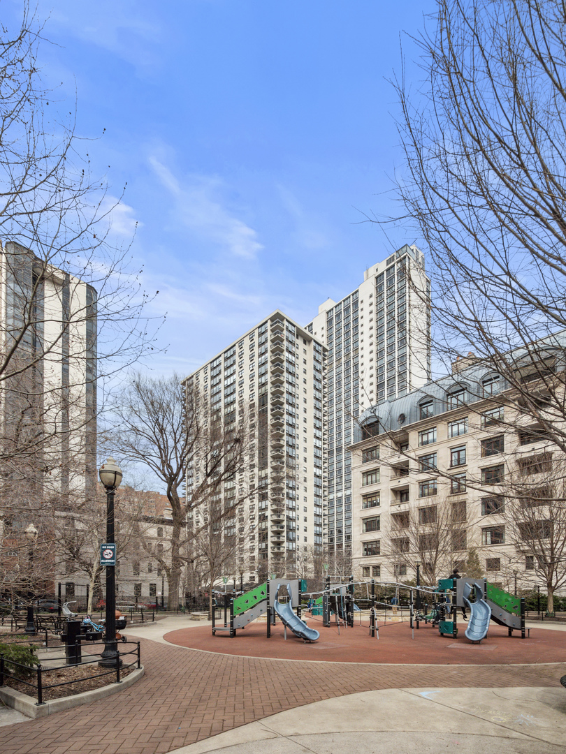 1310 North Ritchie Court, Unit 11C Chicago, IL 60610 - Photo 16 of 21 a city street lined with buildings and trees