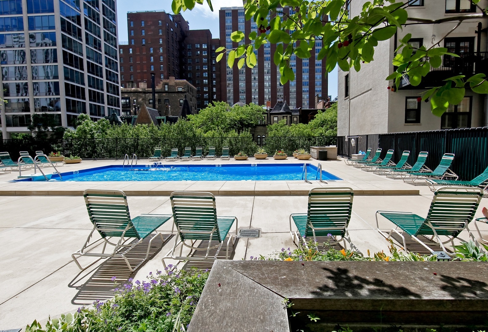 1310 North Ritchie Court, Unit 11C Chicago, IL 60610 - Photo 18 of 21 a view of outdoor space with seating area and trees
