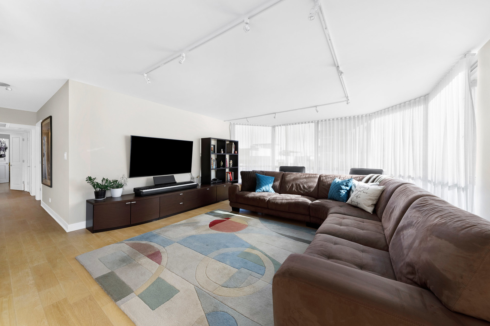 1310 North Ritchie Court, Unit 11C Chicago, IL 60610 - Photo 3 of 21 a living room with furniture and a flat screen tv