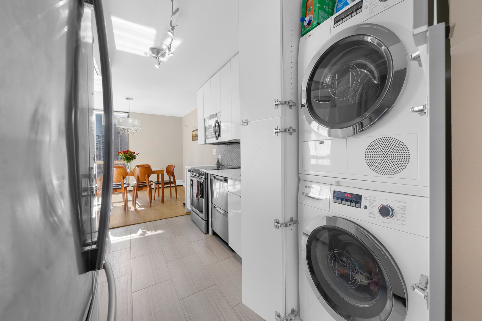 1310 North Ritchie Court, Unit 11C Chicago, IL 60610 - Photo 7 of 21 a view of a storage and utility room with washer and dryer