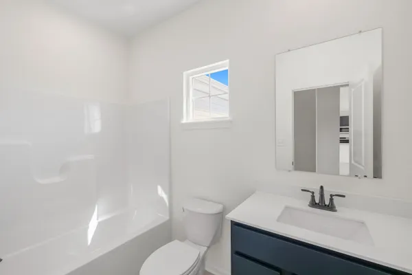 an empty room with a empty space and windows