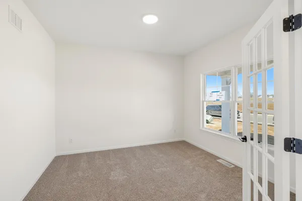 a view of an empty room with a window