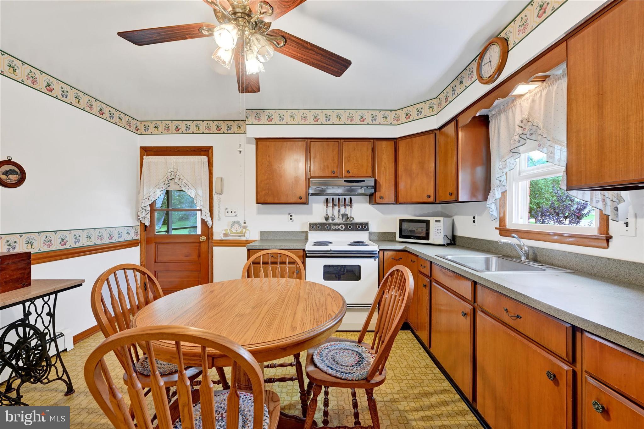 1320 Seling Avenue Rosedale, MD 21237 - Photo 11 of 26 Kitchen with Door to Sun Room