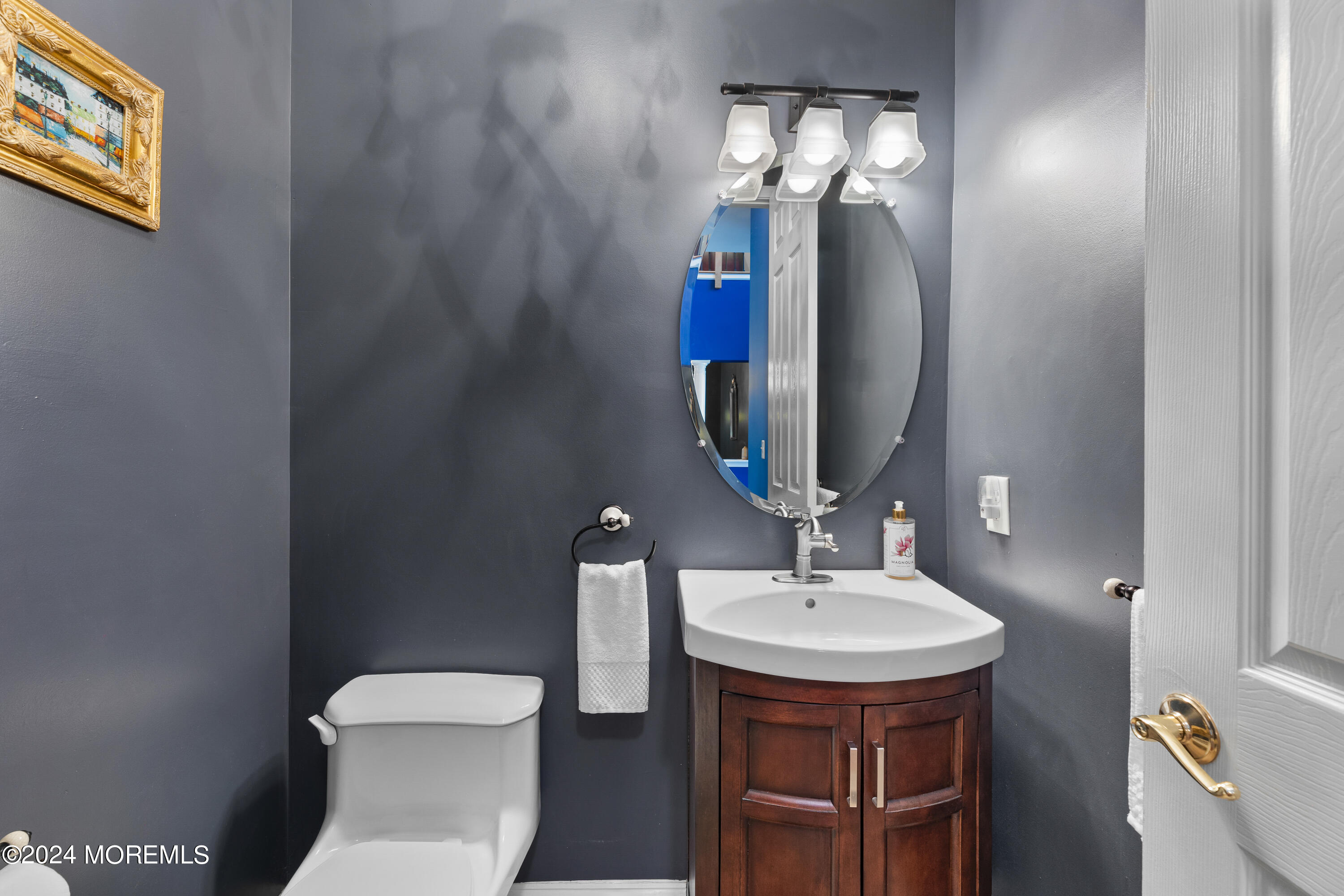 19 Rockspray Court Howell, NJ 07731 - Photo 9 of 37 a bathroom with a toilet sink and mirror