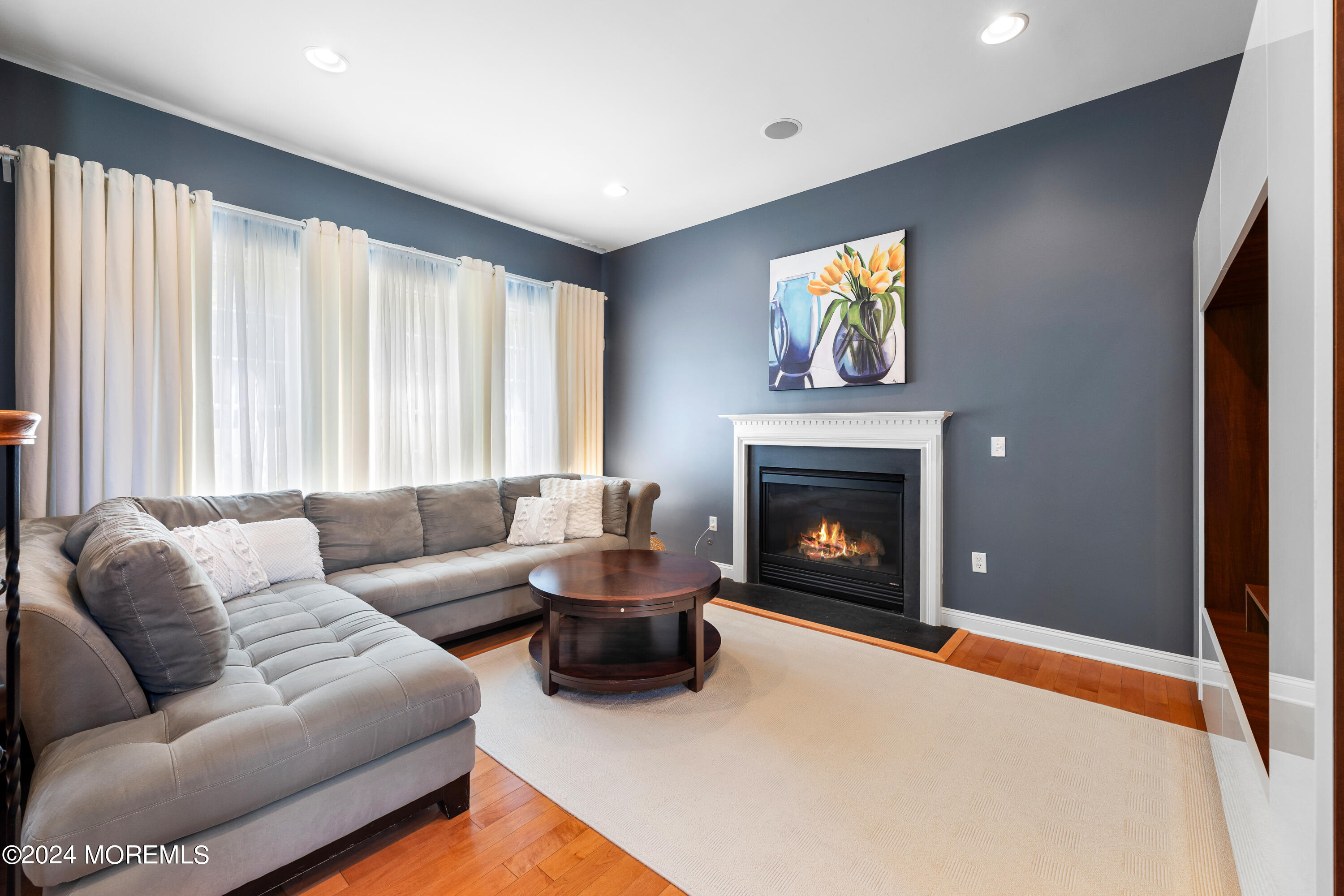 19 Rockspray Court Howell, NJ 07731 - Photo 10 of 37 a living room with furniture and a fireplace