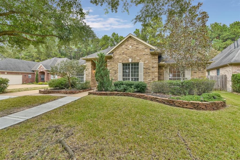 15238 Springhill Bend Lane Cypress, TX 77429 - Photo 1 of 43 a front view of a house with a yard