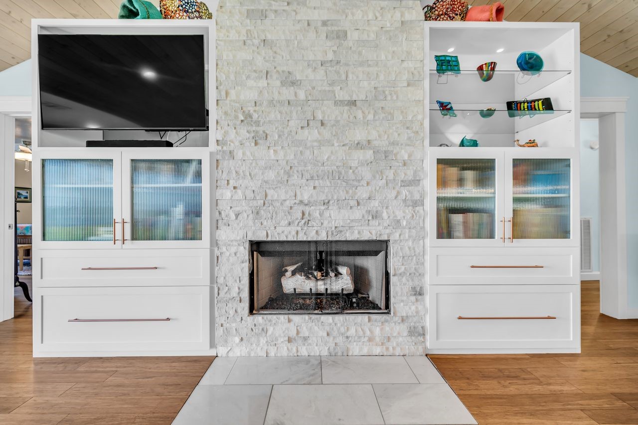 310 Cove Loop Coldspring, TX 77331 - Photo 10 of 48 Stone fireplace with custom built-ins is a nice focal point in the living room.