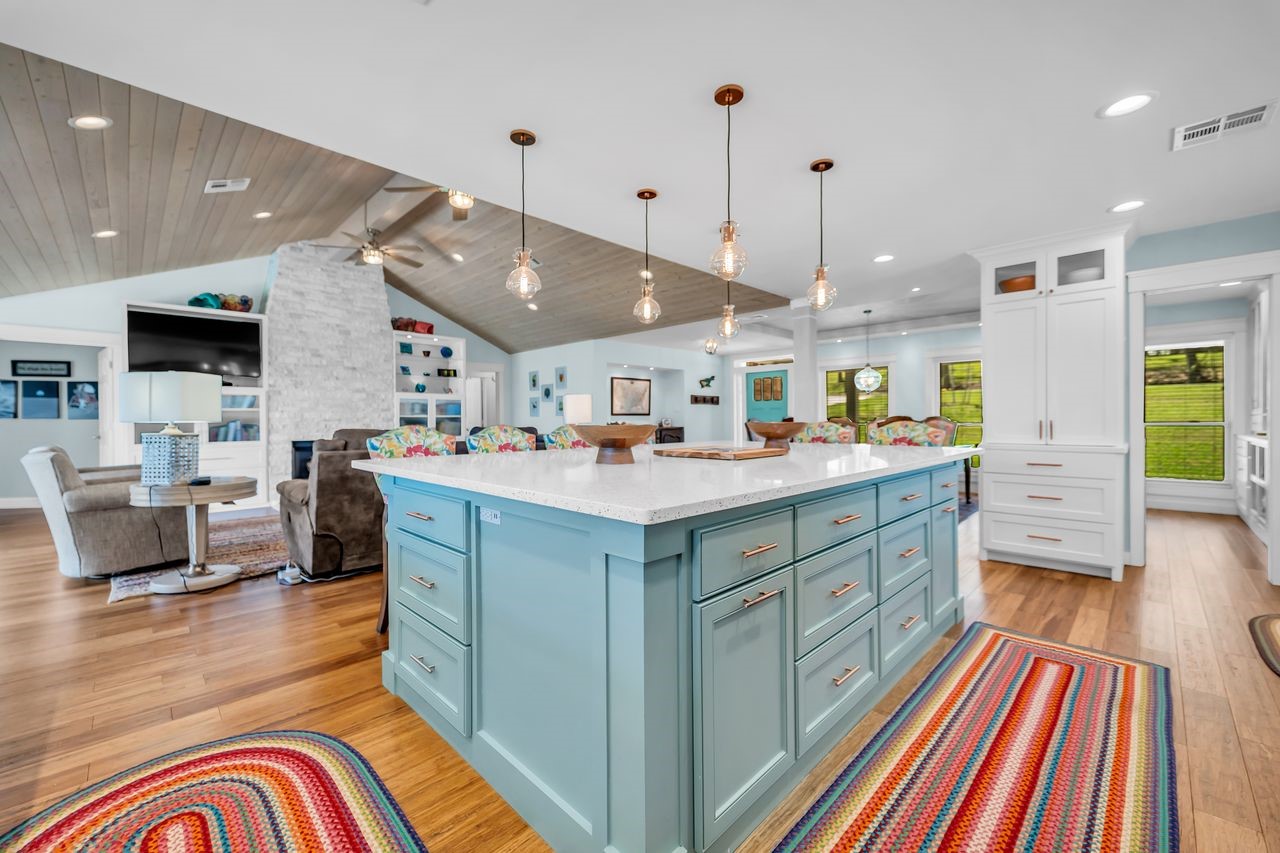 310 Cove Loop Coldspring, TX 77331 - Photo 15 of 48 Beautiful pendant lighting over the large island and an additional built in cabinet with drawers that is currently being used as a coffee bar.