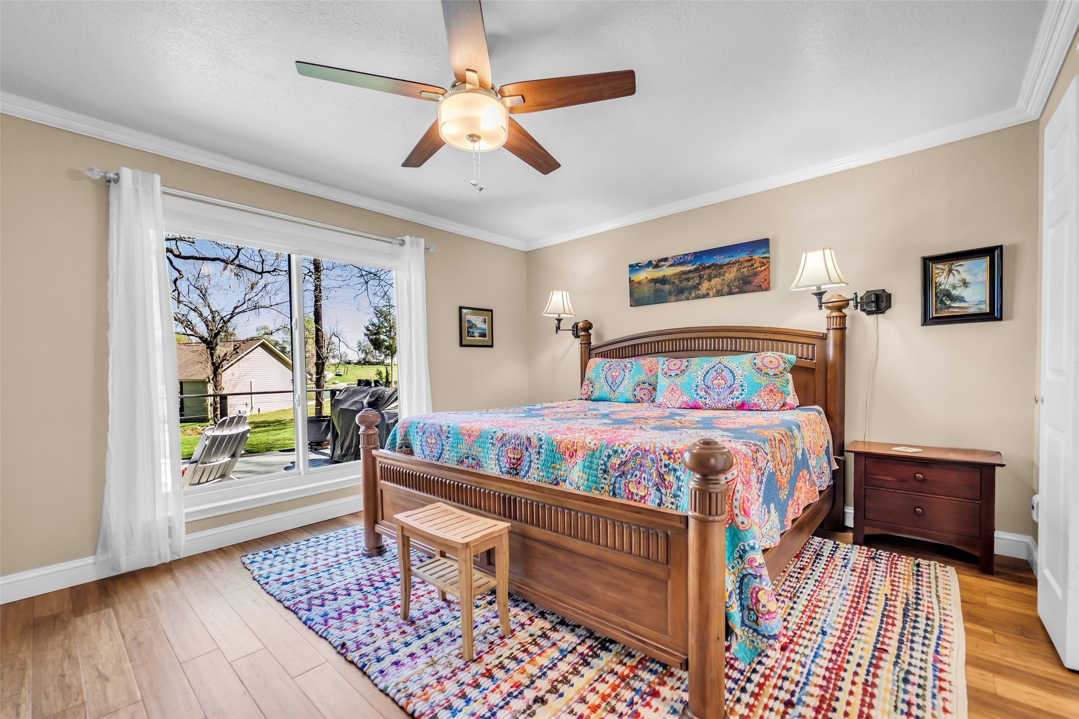 310 Cove Loop Coldspring, TX 77331 - Photo 20 of 48 The primary bedroom is huge with windows offering a nice view of back yard and lake.
