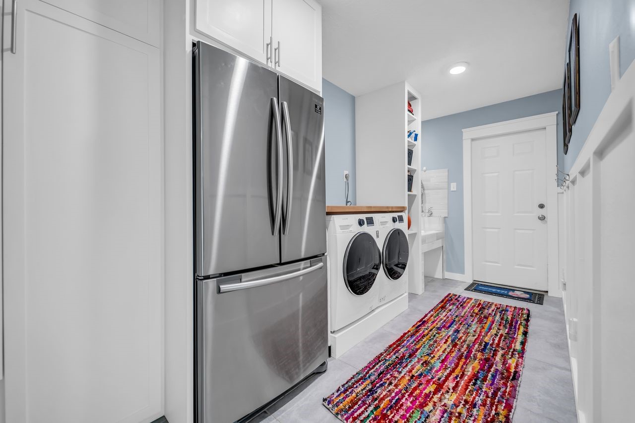 310 Cove Loop Coldspring, TX 77331 - Photo 29 of 48 This laundry/mud room has a space for folding clothes, a pet washing staging and custom built in cabinets.