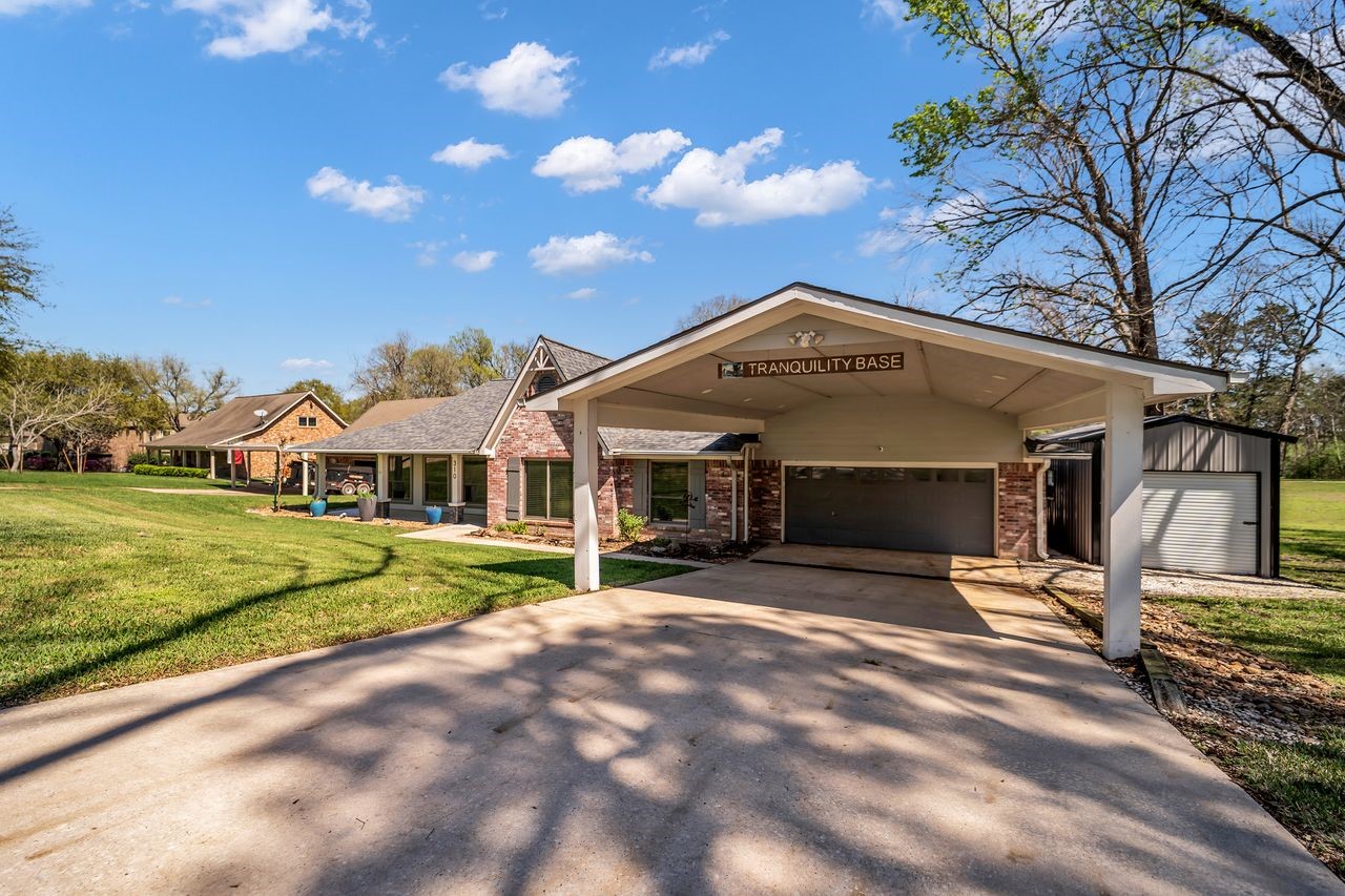 310 Cove Loop Coldspring, TX 77331 - Photo 3 of 48 Welcome to Tranquility Base, a beautiful lakefront home on Lake Livingston.