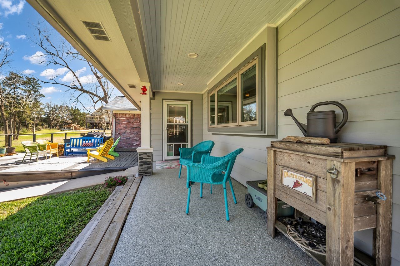 310 Cove Loop Coldspring, TX 77331 - Photo 31 of 48 Covered back porch off the living room sitting area.