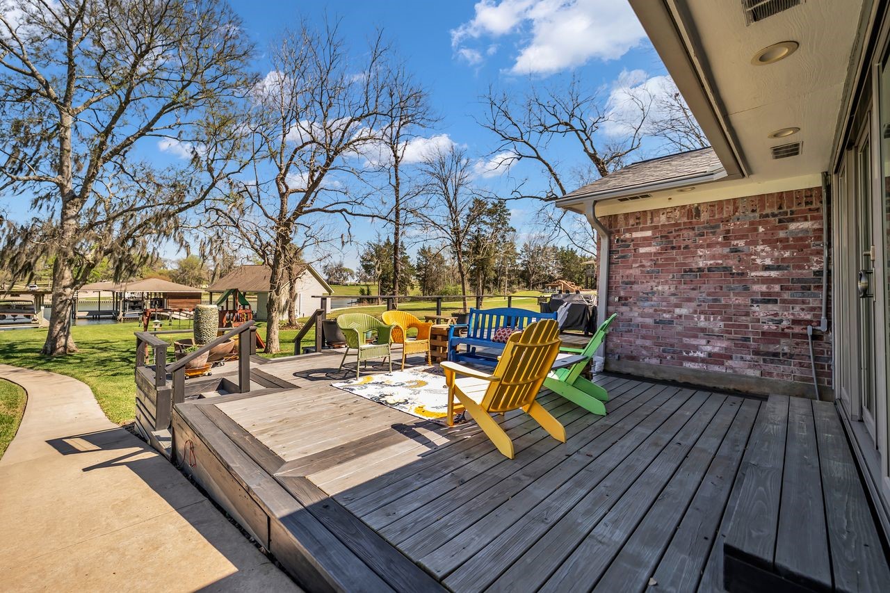 310 Cove Loop Coldspring, TX 77331 - Photo 32 of 48 Nice deck has been added for sitting and enjoying the lake view.