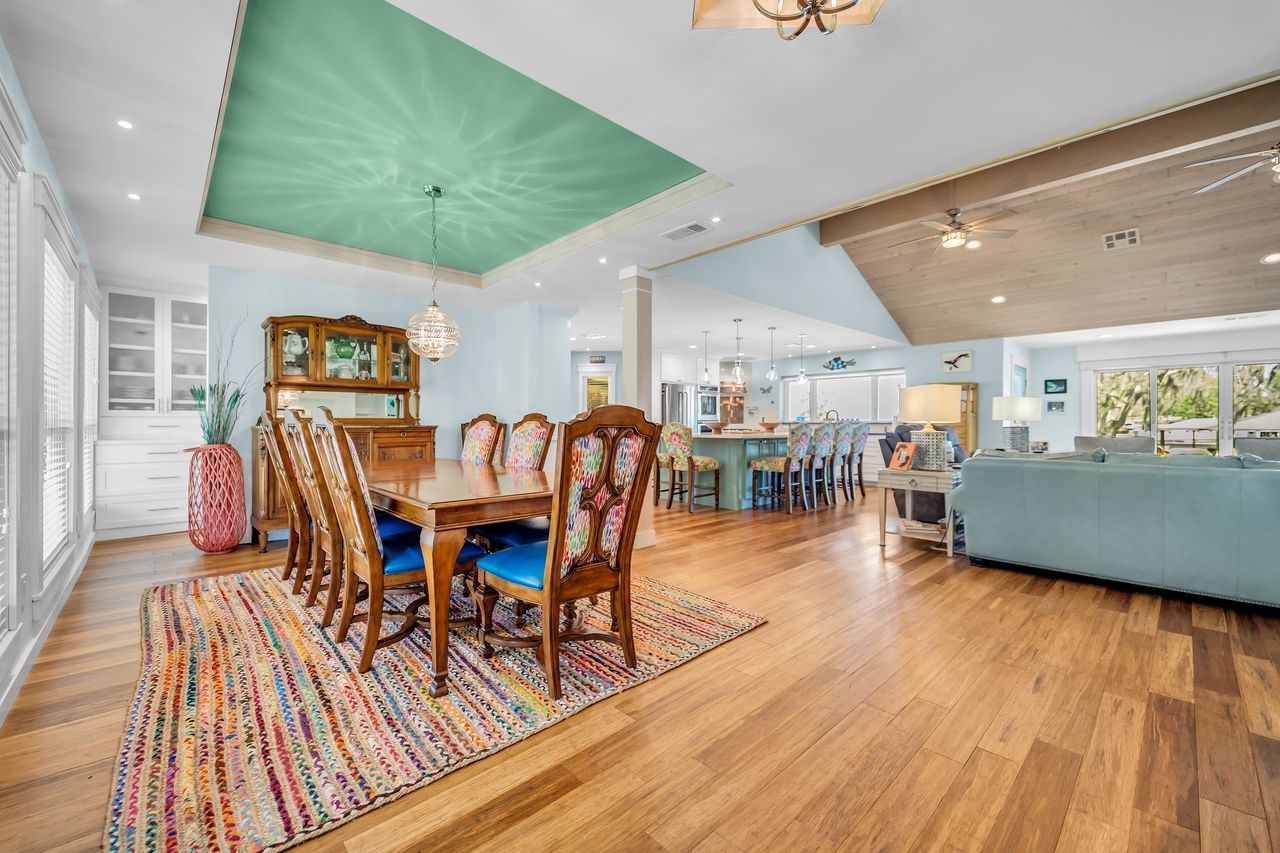 310 Cove Loop Coldspring, TX 77331 - Photo 6 of 48 As you enter the front door, the dining area is on the left. With an accent colored tray ceiling and beautiful chandelier, this makes a perfect place for hosting dinner parties.