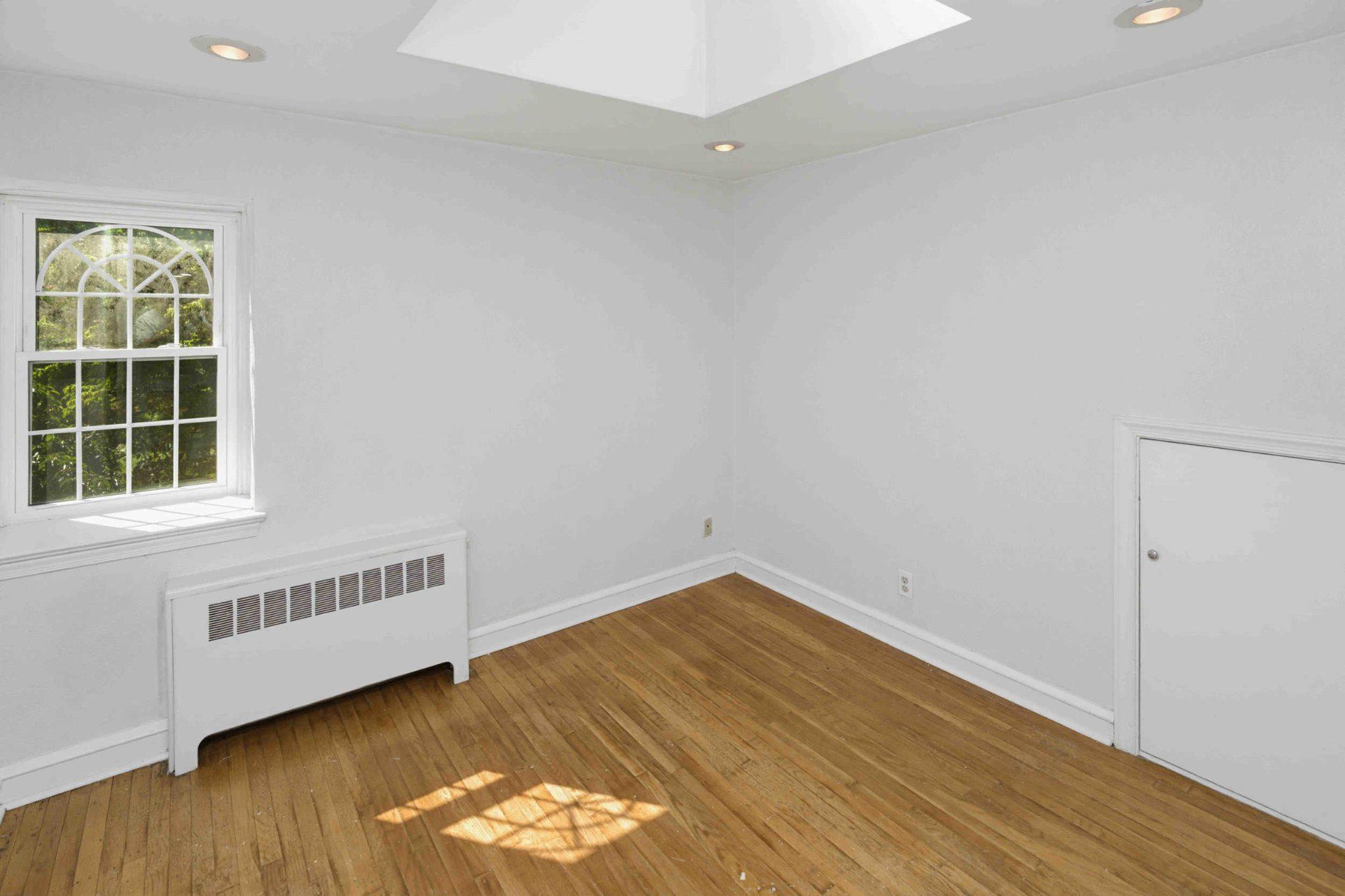 1268 Rydal Road Jenkintown, PA 19046 - Photo 30 of 31 an empty room with wooden floor and windows