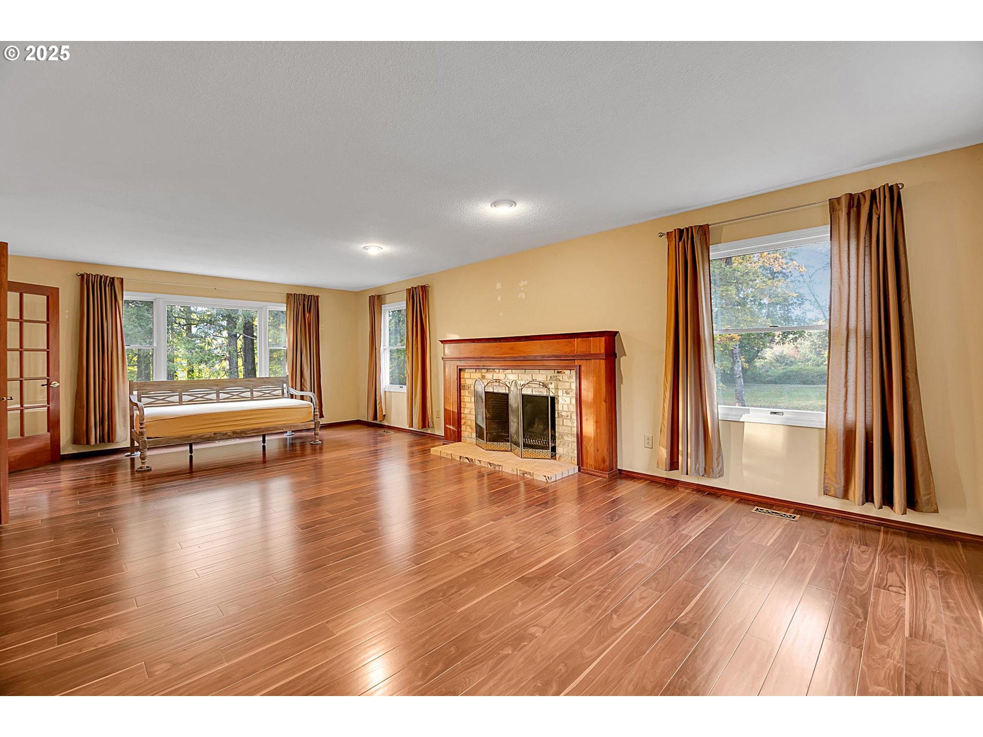 12077 Southeast Lusted Road Sandy, OR 97055 - Photo 30 of 44 a view of an empty room with wooden floor and a window