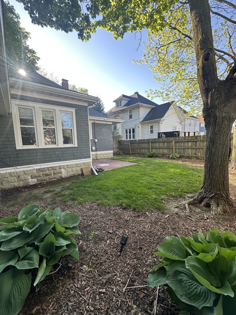 1307 South Main Street Bloomington, IL 61701 - Photo 47 of 48 a front view of a house with garden