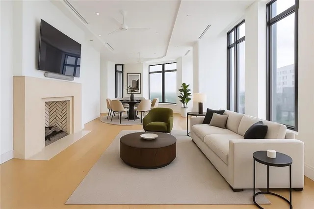 a living room with fireplace furniture and a flat screen tv