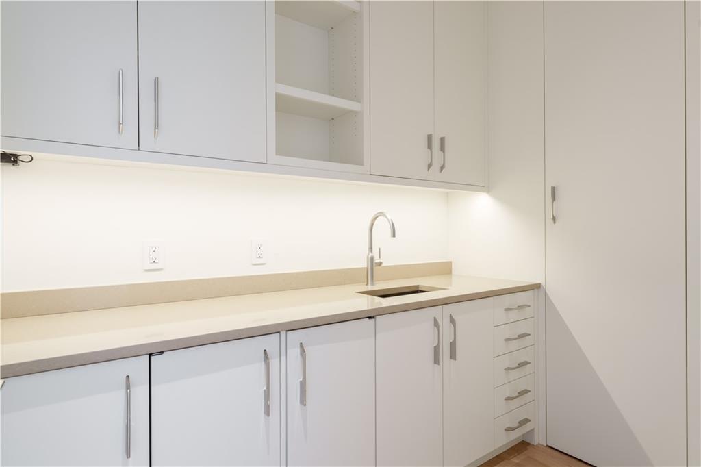 3376 Peachtree Road Northeast, Unit 34A Atlanta, GA 30326 - Photo 12 of 30 a kitchen with white cabinets