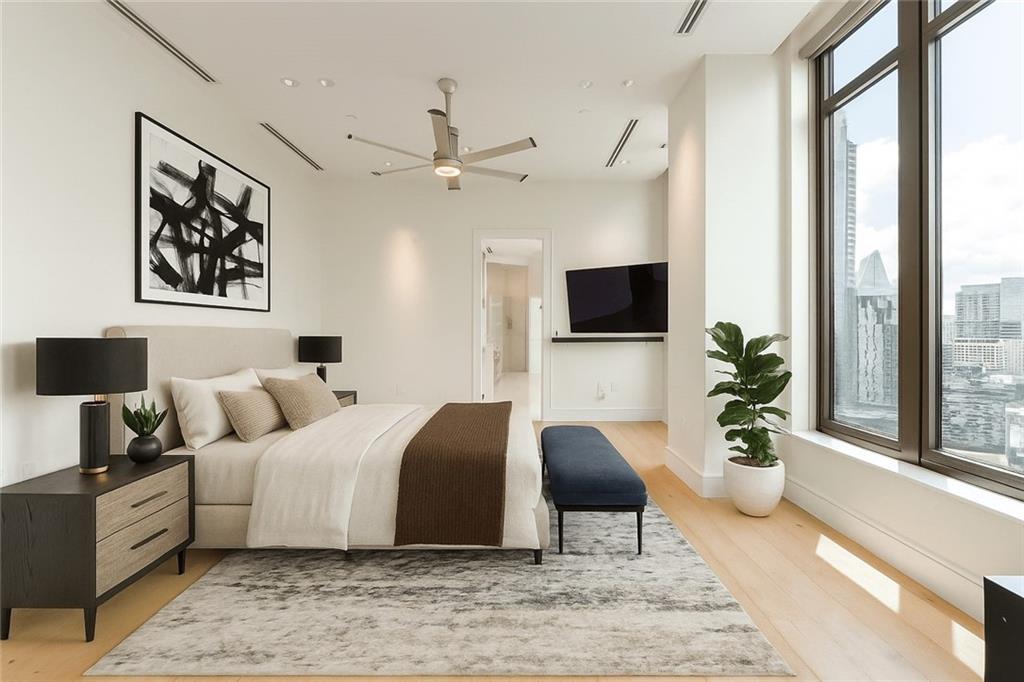 3376 Peachtree Road Northeast, Unit 34A Atlanta, GA 30326 - Photo 14 of 30 a bedroom with a bed a couch and a large window