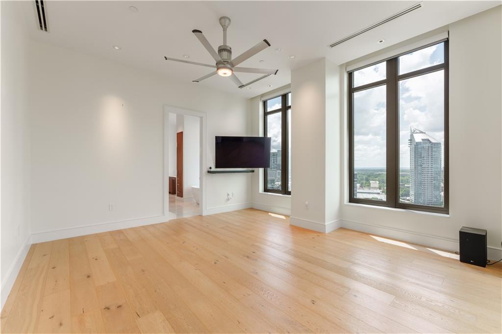 3376 Peachtree Road Northeast, Unit 34A Atlanta, GA 30326 - Photo 15 of 30 a view of an empty room with a window and a kitchen area