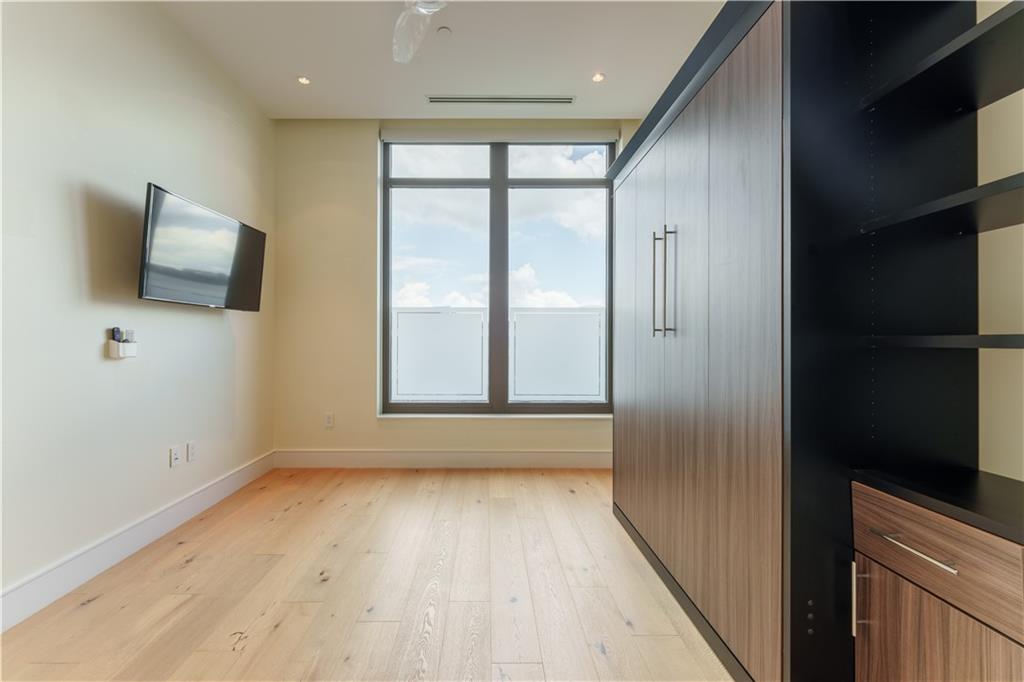 3376 Peachtree Road Northeast, Unit 34A Atlanta, GA 30326 - Photo 21 of 30 a view of room with window and flat screen tv