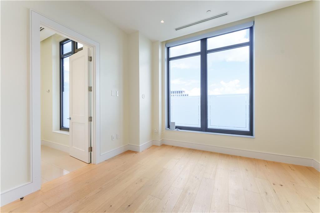3376 Peachtree Road Northeast, Unit 34A Atlanta, GA 30326 - Photo 22 of 30 an empty room with windows and closet