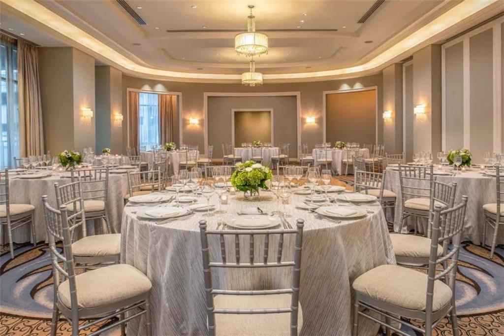 3376 Peachtree Road Northeast, Unit 34A Atlanta, GA 30326 - Photo 30 of 30 a large kitchen with a table and chairs