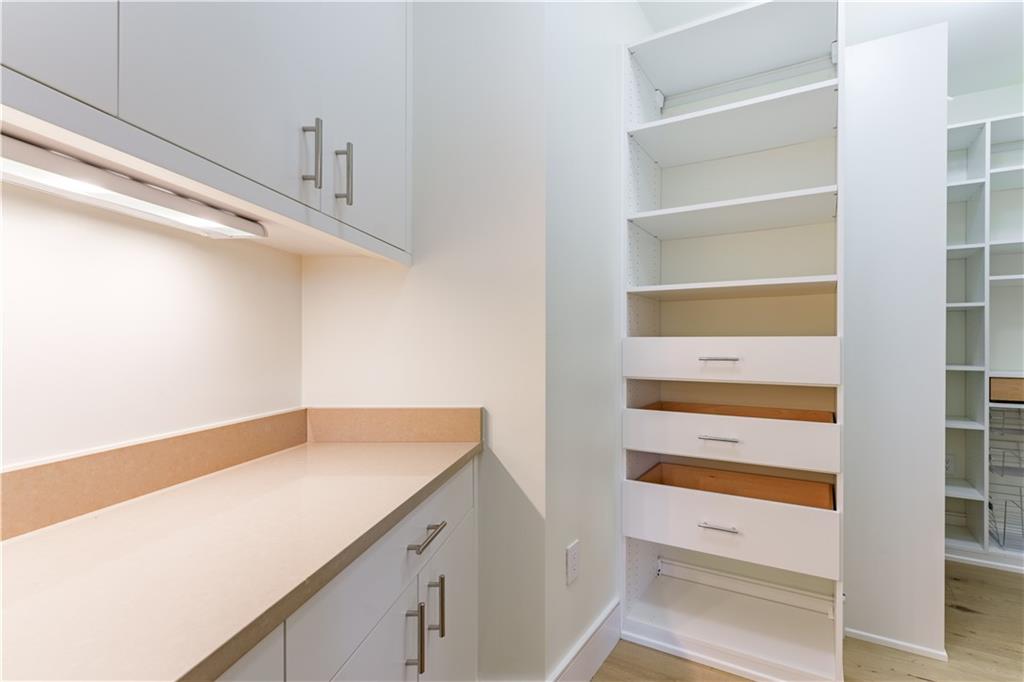 3376 Peachtree Road Northeast, Unit 34A Atlanta, GA 30326 - Photo 9 of 30 a utility room with wooden floor