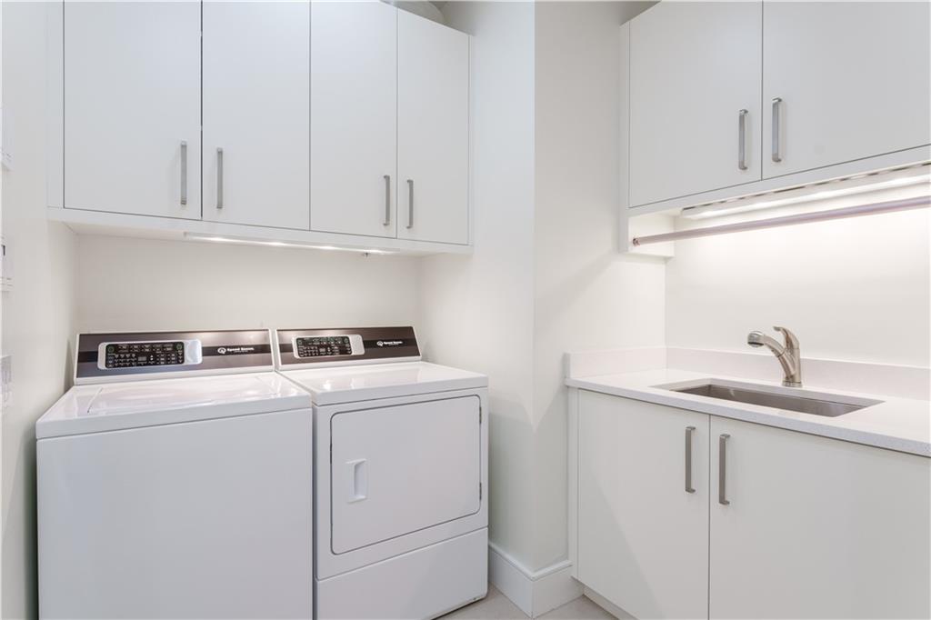 3376 Peachtree Road Northeast, Unit 34A Atlanta, GA 30326 - Photo 10 of 30 a utility room with dryer and washer