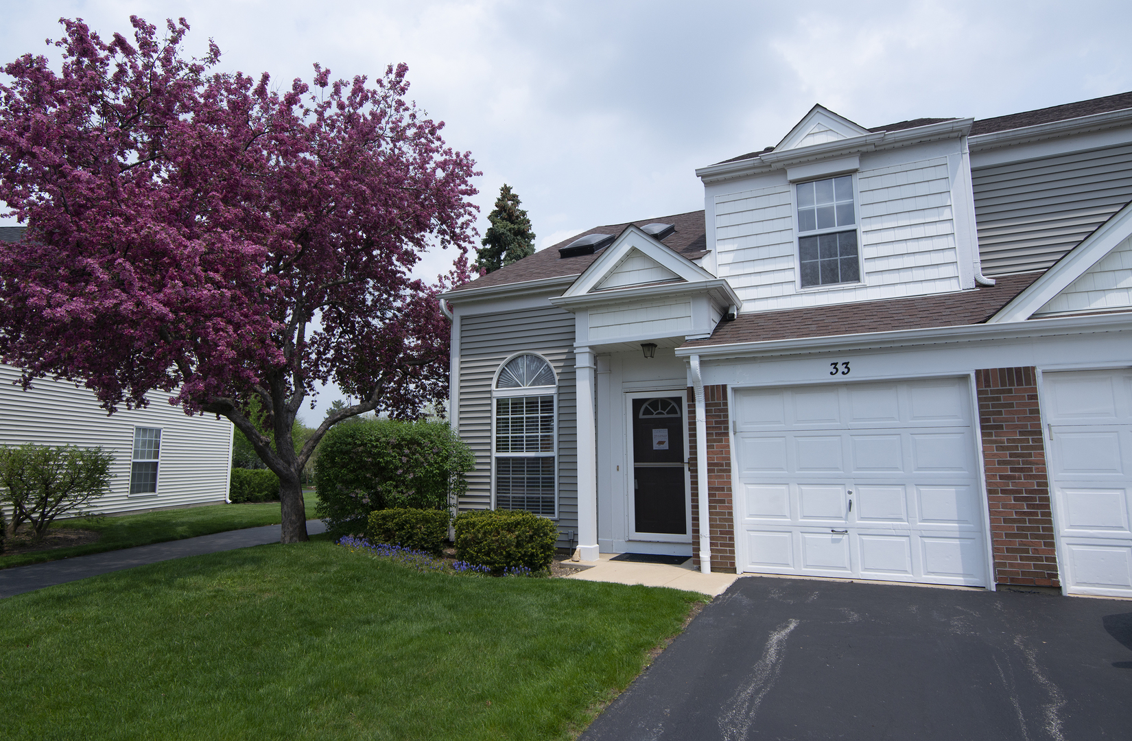 33 North Oltendorf Road Streamwood, IL 60107 - Photo 2 of 23 a front view of a house with a garden