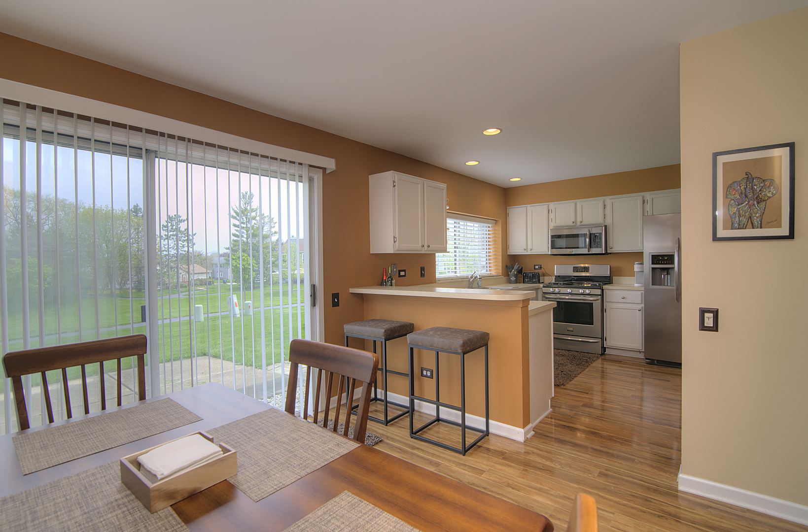 33 North Oltendorf Road Streamwood, IL 60107 - Photo 8 of 23 a kitchen with stainless steel appliances granite countertop a stove and a refrigerator