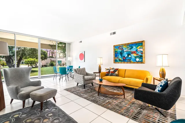 a living room with furniture and a rug
