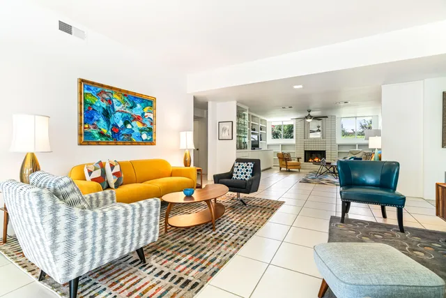 a view of a chairs and table in backyard