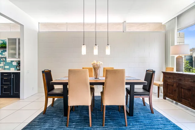 a large kitchen with stainless steel appliances granite countertop a sink counter space and cabinets